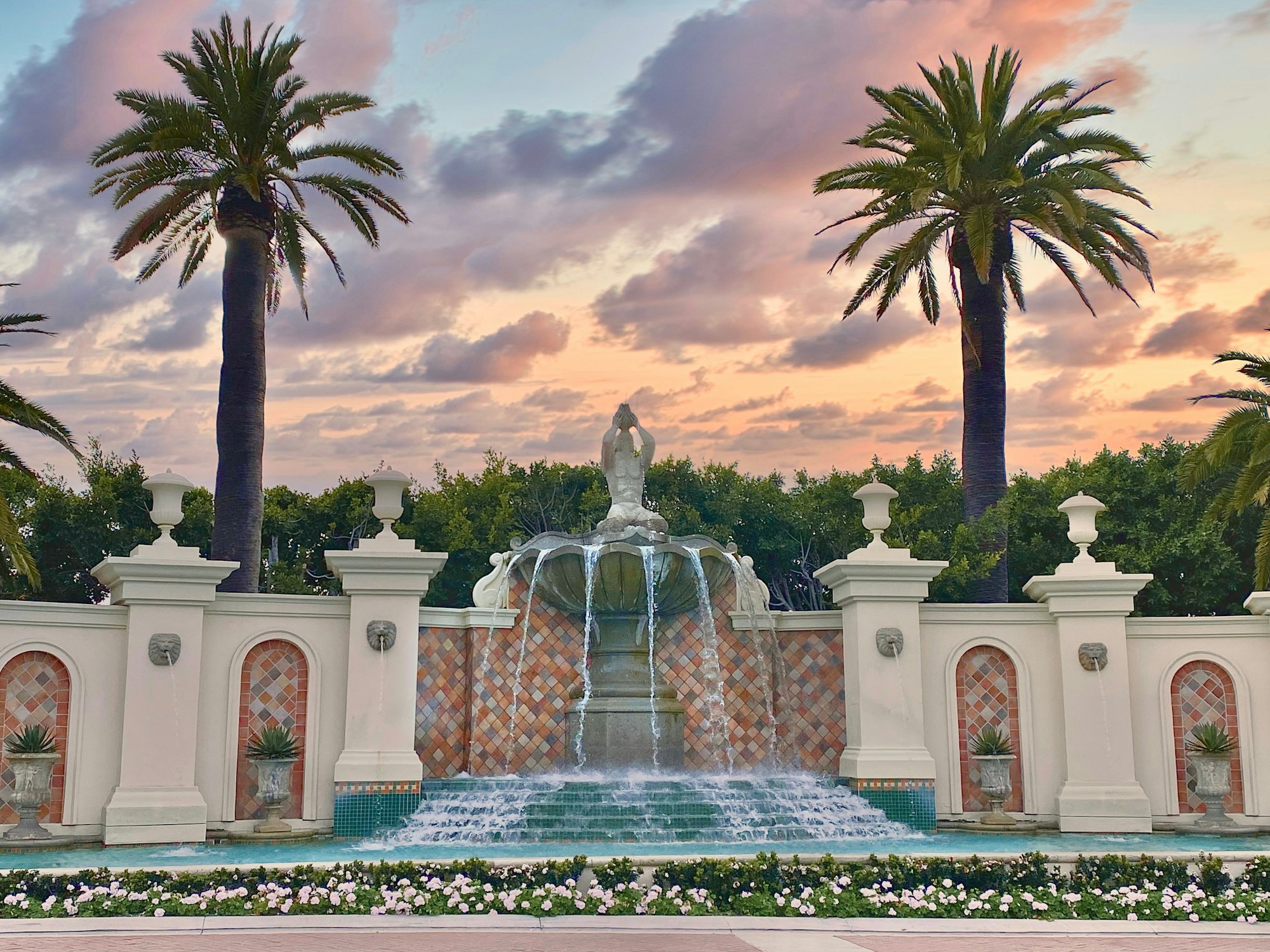 The grand entrance to an exclusive resort in Dana Point with gorgeous fountain and sculpture framed